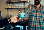 Coffee, service and hands of people at a cafe for a drink, breakfast or lunch. Business, waiter and person giving an espresso order to a customer at a cafeteria while working at a restaurant