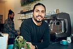 Portrait, coffee shop and barista with a man at work behind the counter in a cafe or restaurant as a waiter. Employee, retail or small business with a male employee working in a cafeteria for service