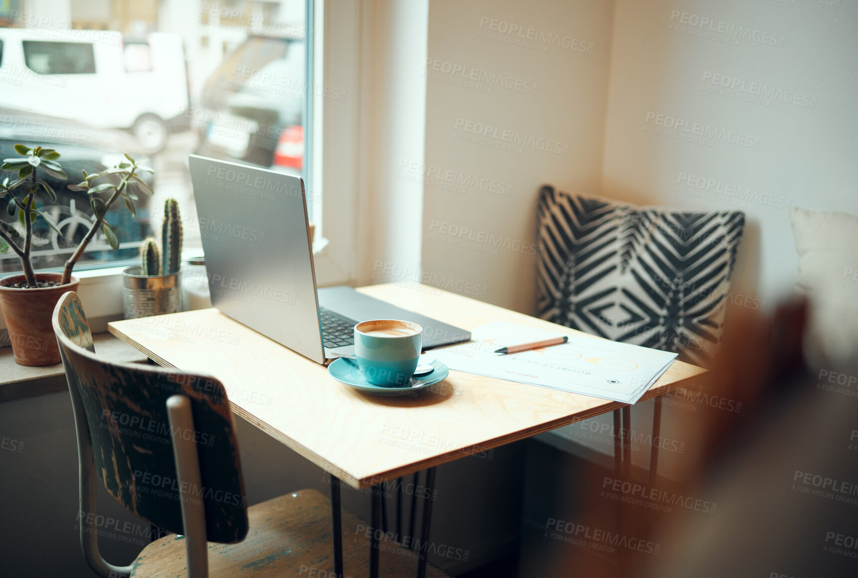 Buy stock photo Laptop, documents and coffee shop with a table and chairs in an empty restaurant for freelance or remote work. Business, cafe and coffee with a pen and paper in a workspace at an internet cafe