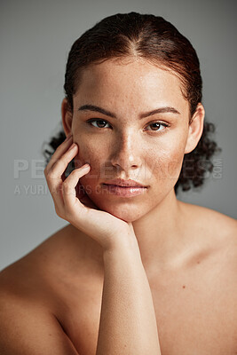 Buy stock photo Black woman, skincare and natural face for beauty cosmetic and glow treatment campaign portrait. Healthy body care of model with beautiful freckles on hydrated skin in gray studio background.

