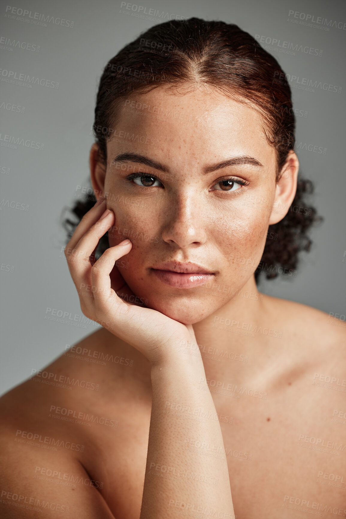 Buy stock photo Black woman, skincare and natural face for beauty cosmetic and glow treatment campaign portrait. Healthy body care of model with beautiful freckles on hydrated skin in gray studio background.

