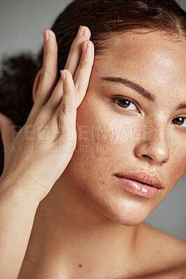 Buy stock photo Skin, beauty and black woman portrait with skincare glow from spa treatment and makeup. Model, hand and face of a person relax after dermatology detox in a studio with gray background feeling healthy