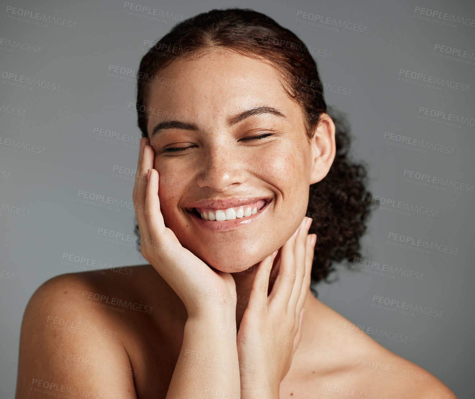 Buy stock photo Face, beauty and satisfaction with a model black woman in studio on a gray background to promote natural skincare. Facial, wellness and makeup with an attractive young female happy with cosmetics