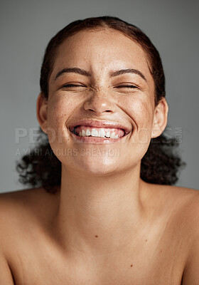 Buy stock photo Face, beauty and funny with a model black woman in studio on a gray background laughing for skincare. Facial, wellness and makeup with an attractive young female happy with her skin product