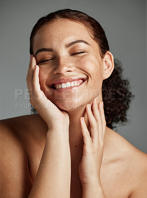 Buy stock photo Face, beauty and skincare with a model black woman in studio on a gray background to promote natural care. Facial, wellness and makeup with an attractive young female happy with her skin product