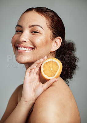 Buy stock photo Woman, studio portrait and orange for skincare, health and wellness with cosmetic glow, self care and backdrop. Model, black woman and fruit for cosmetics, diet and healthy natural skin by background