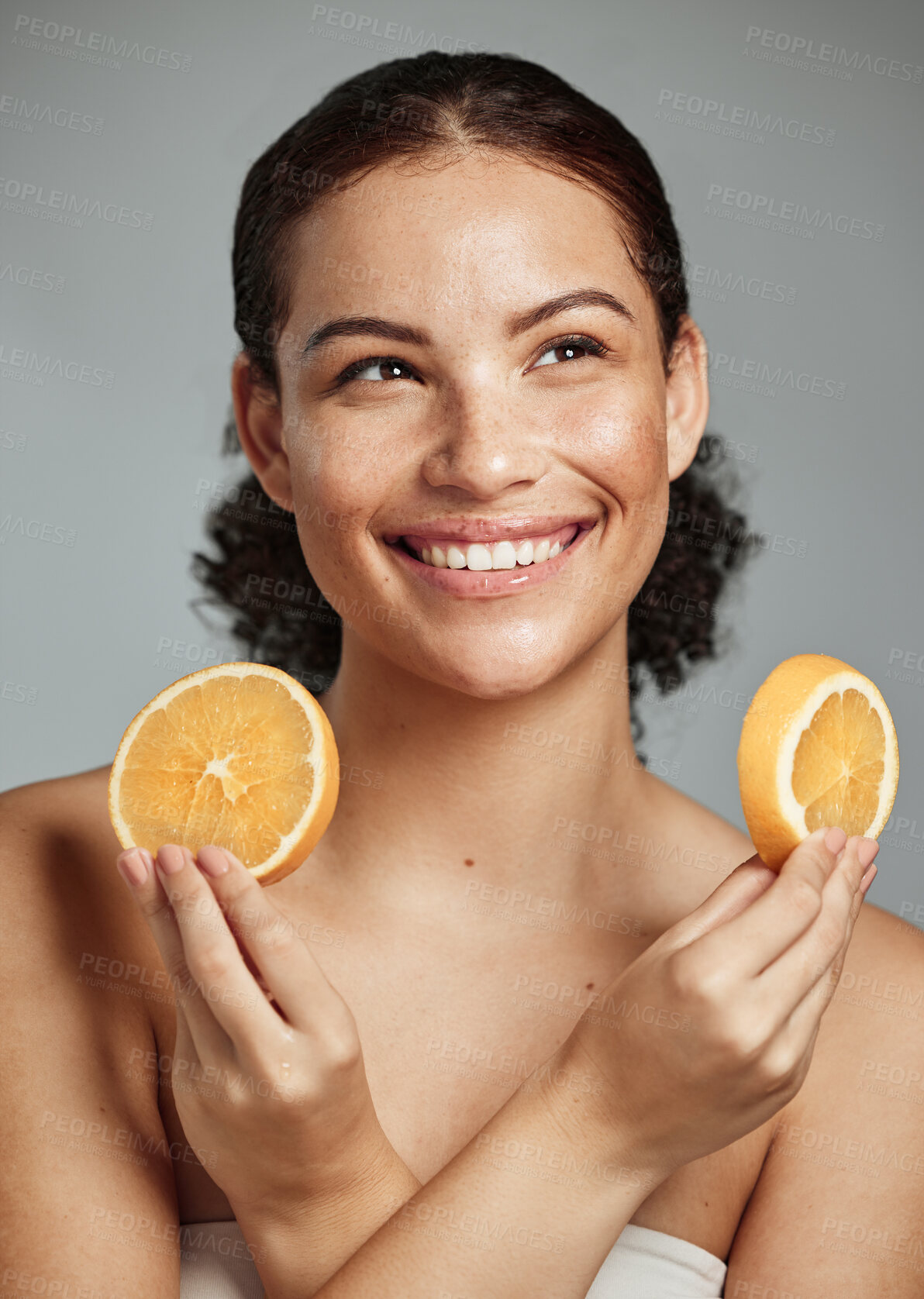 Buy stock photo Model, orange and hands in studio for skincare, health and wellness for cosmetic glow, self care and backdrop. Black woman, fruit aesthetic and diet for cosmetics, detox or natural skin by background