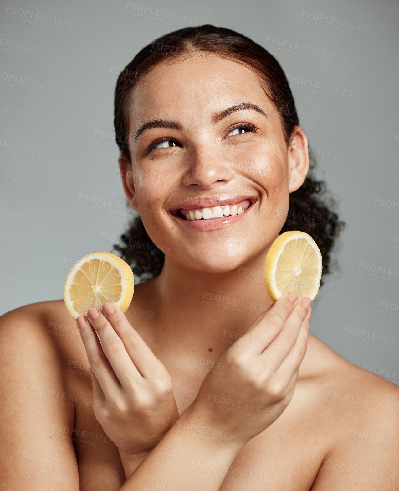 Buy stock photo Face, beauty and lemon with a model black woman in studio thinking about natural skincare or treatment. Happy, smile and idea with an attractive young female posing to promote diet or nutrition