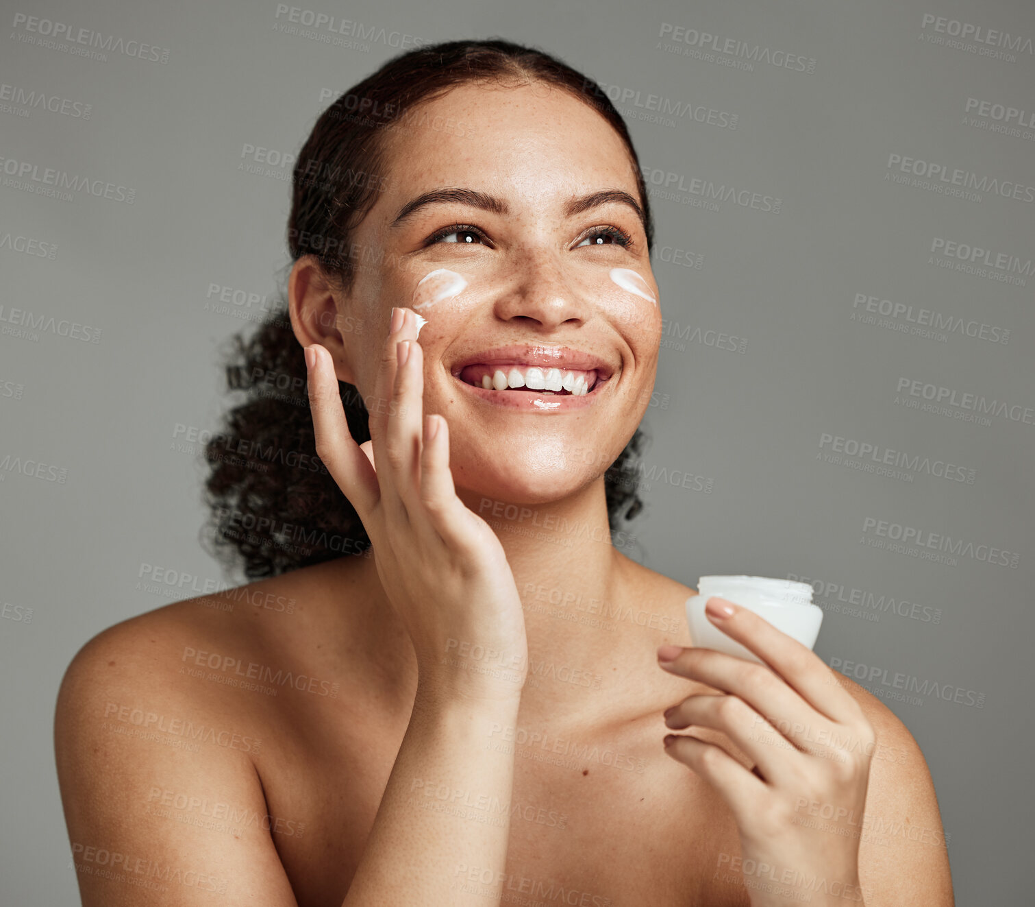 Buy stock photo Black woman, smile and face beauty cream for skincare wellness shine, cosmetics dermatology and salon spa product in studio. African girl, spf lotion and self care happiness for luxury facial glow