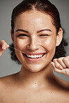 Teeth flossing, dental floss and portrait of woman with a smile in studio for oral hygiene, health and wellness. Face of happy female on grey for self care, healthcare and grooming for healthy mouth