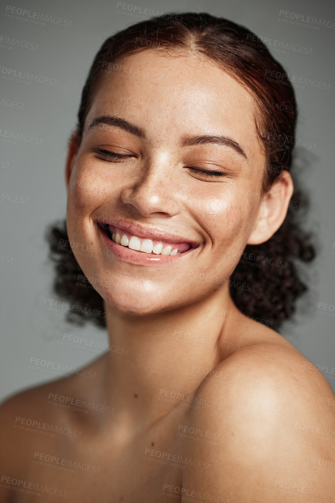 Buy stock photo Face, beauty and skincare with a model black woman in studio on a gray background to promote natural care. Facial, wellness and makeup with an attractive young female happy with her skin product