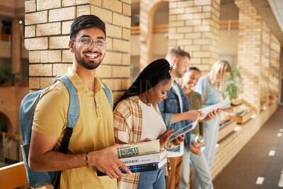 Buy stock photo University, hallway and portrait of Indian man and students standing in row together with books at business school. Friends, education and future, happy man in study group on campus in lobby for exam