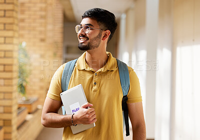 Buy stock photo University student, college and indian man with a tablet and backpack while walking down campus corridor. Young gen z male happy about education, learning and future after studying at school building