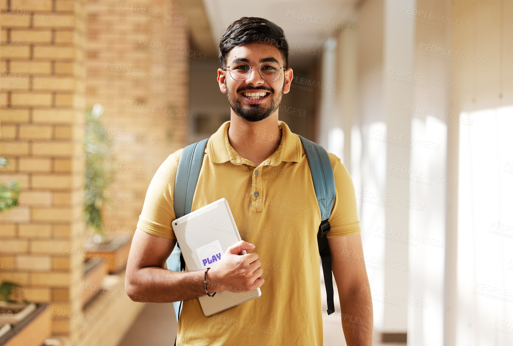 Buy stock photo Face portrait, student and man in university ready for back to school learning, goals or targets. Scholarship, education and happy, confident and proud male from India holding tablet for studying.