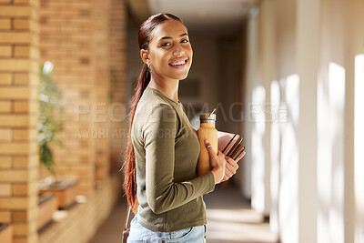 Buy stock photo Woman portrait, university student and college books and water bottle while walking at campus with a smile. Gen z female happy about education, learning and future after studying at school building