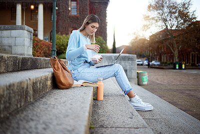 Buy stock photo College, study and food with woman and laptop for education, lunch break and academy research. University, knowledge and goal with girl student and sandwich on stairs of campus for relax and learning
