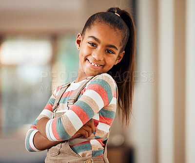 Buy stock photo Happy, smile and portrait of a girl child in her home with a positive mindset standing with crossed arms. Happiness. beautiful and young kid with a casual, stylish and trendy outfit posing in house.