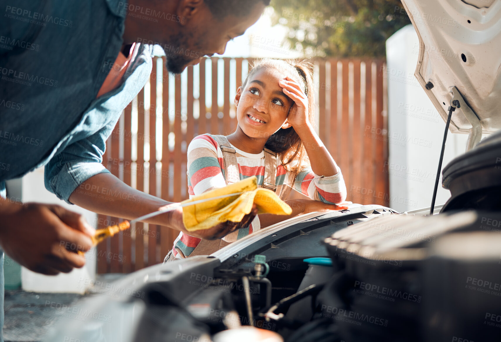 Buy stock photo Car problem, child and dad working as a mechanic while teaching daughter to change motor oil and fix vehicle. Black man and girl kid learning, talking and bonding while busy on engine for transport 