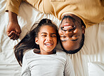 Family, love and black man with girl or child lying in bed in a home smiling and bonding by having fun together. Father, dad and daughter in a house with face happiness in a bedroom feeling happy