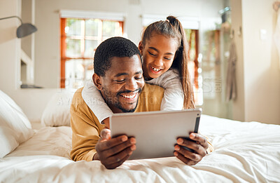 Buy stock photo Black family, tablet or learning with a father and daughter lying together on a bed in their home for education. Relax, internet and kids with a man and girl in a bedroom for growth or development