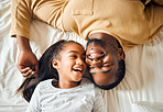 Black family, father and daughter love on a bed with a smile on face or laughing at funny memory. Above man and child together in home bedroom for bonding, support and care with safety and security 