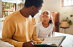 Happy, child and father reading a book for education, learning and information in their family home. Love, smile and African dad with a girl in the bedroom for a story, bonding and quality time