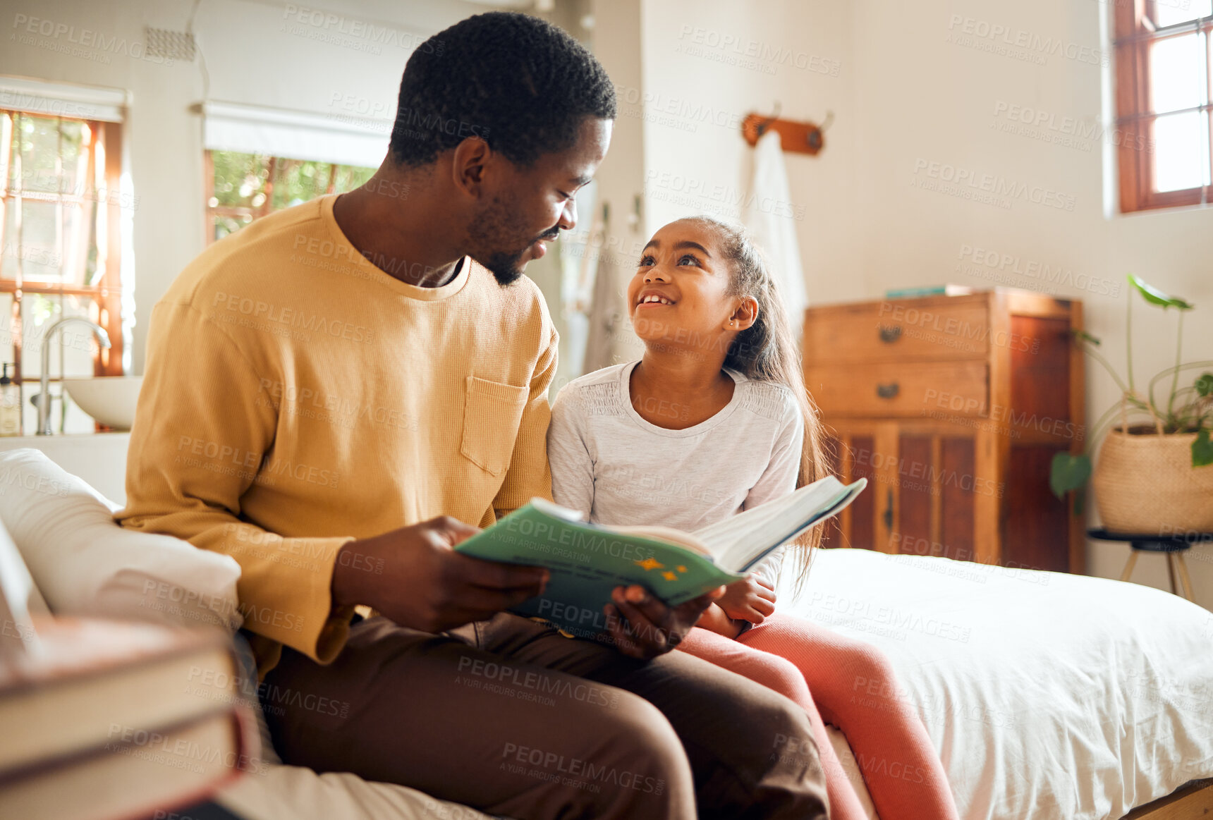 Buy stock photo Black family, dad reading book to child for learning, support and language development, bonding in bedroom. Happy people, father and girl love with creative storytelling, education or home teaching