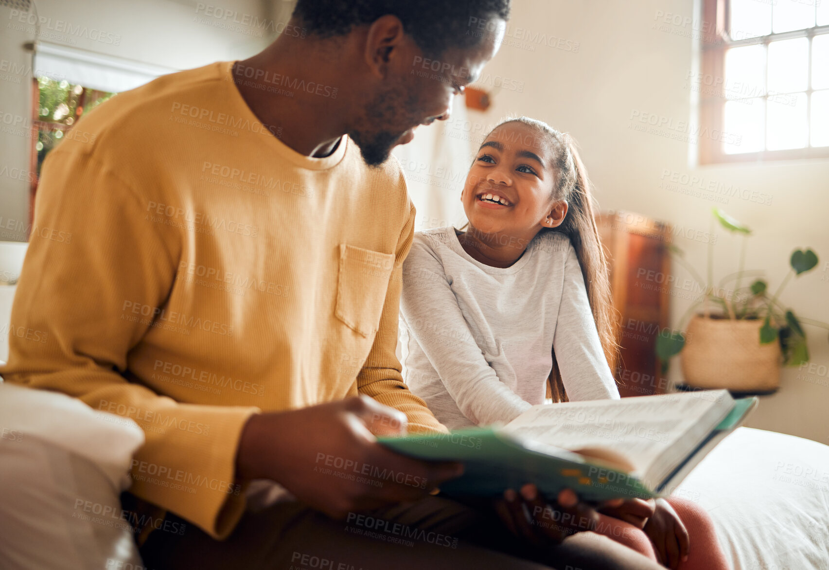 Buy stock photo Father, child and book for story time on bed with smile enjoying reading or listening and bonding together at home. Happy dad and daughter sitting with textbook for learning or education in bedroom