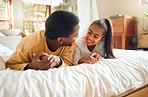 Family, father and girl kid talking, spending quality time together with love and care, relax in bedroom at home. Black man, child and happy people, communication and relationship with childhood