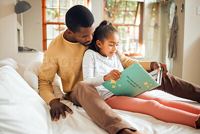 Buy stock photo Black family, reading book and learning while on a bed for story time in house bedroom. Man or dad teaching girl child to read language, fantasy and development in happy home with love and support