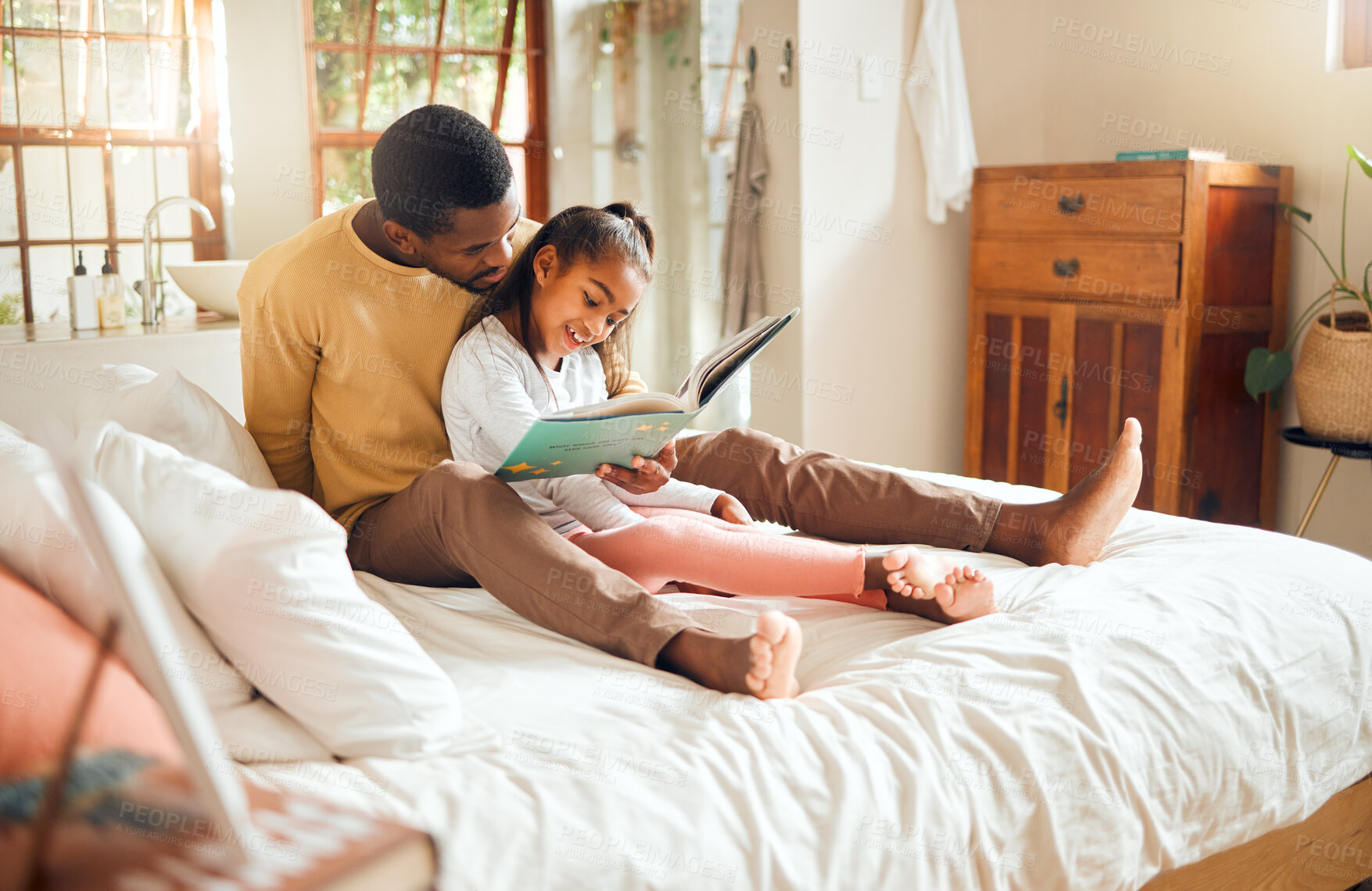 Buy stock photo Black family, reading book and bedroom with father and child together for story time. Man or dad and girl together in home bedroom for bonding, learning and education or knowledge with fantasy