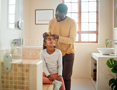 Buy stock photo Father, daughter and brushing hair in a home bathroom with love, trust and support. Man teaching child self care, health tips and wellness with communication, talking about confidence and respect