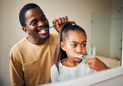 Buy stock photo Oral hygiene, brushing teeth and father with daughter in a bathroom for learning and morning grooming. Dental care, black family and girl with parent, cleaning and looking in a mirror at home