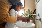 Black family, father and child washing hands with clean water in home bathroom. Man teaching girl while cleaning body part for safety, healthcare and bacteria for learning about health and wellness