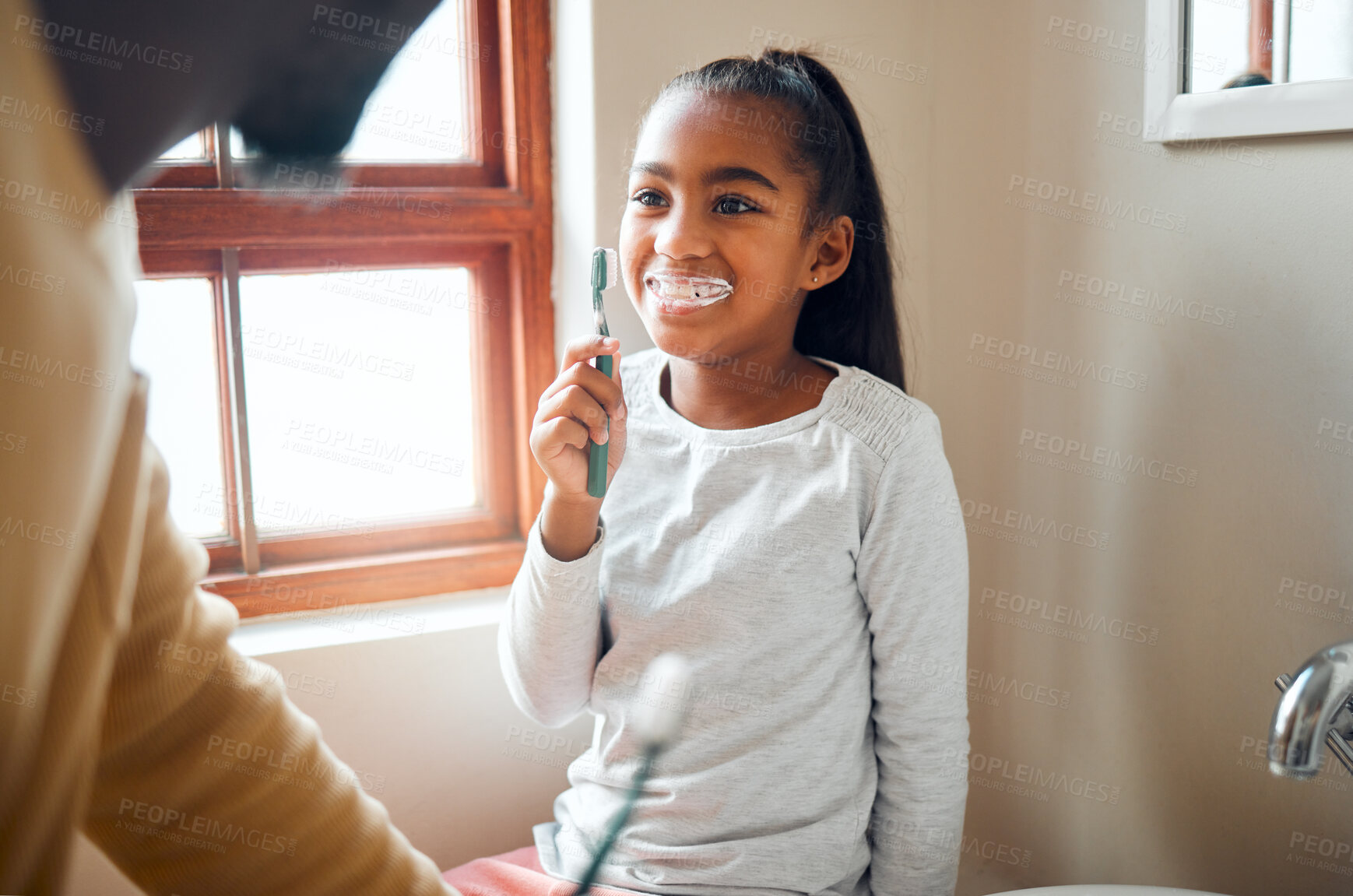 Buy stock photo Daughter, father and brushing teeth in a bathroom for hygiene, grooming and bonding. Oral care, girl and parent for morning cleaning while having fun with black family who laugh and smile at home