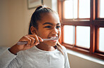Girl brushing teeth, toothbrush for hygiene and clean mouth with fresh breath and dental health. Child cleaning with toothpaste in bathroom, wellness at family home and healthy gums for oral care