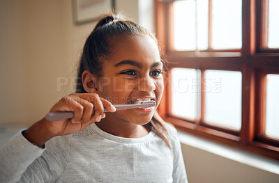 Buy stock photo Girl brushing teeth, toothbrush for hygiene and clean mouth, fresh breath for oral care and dental health. Black child cleaning with toothpaste in bathroom, wellness at family home and healthy gums 