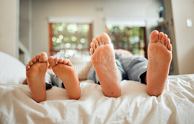 Buy stock photo Feet, family and dad sleeping on a bed with child in a bedroom at a home or house bonding together. Resting, break and parent with kid barefoot bonding and relaxing together spending time