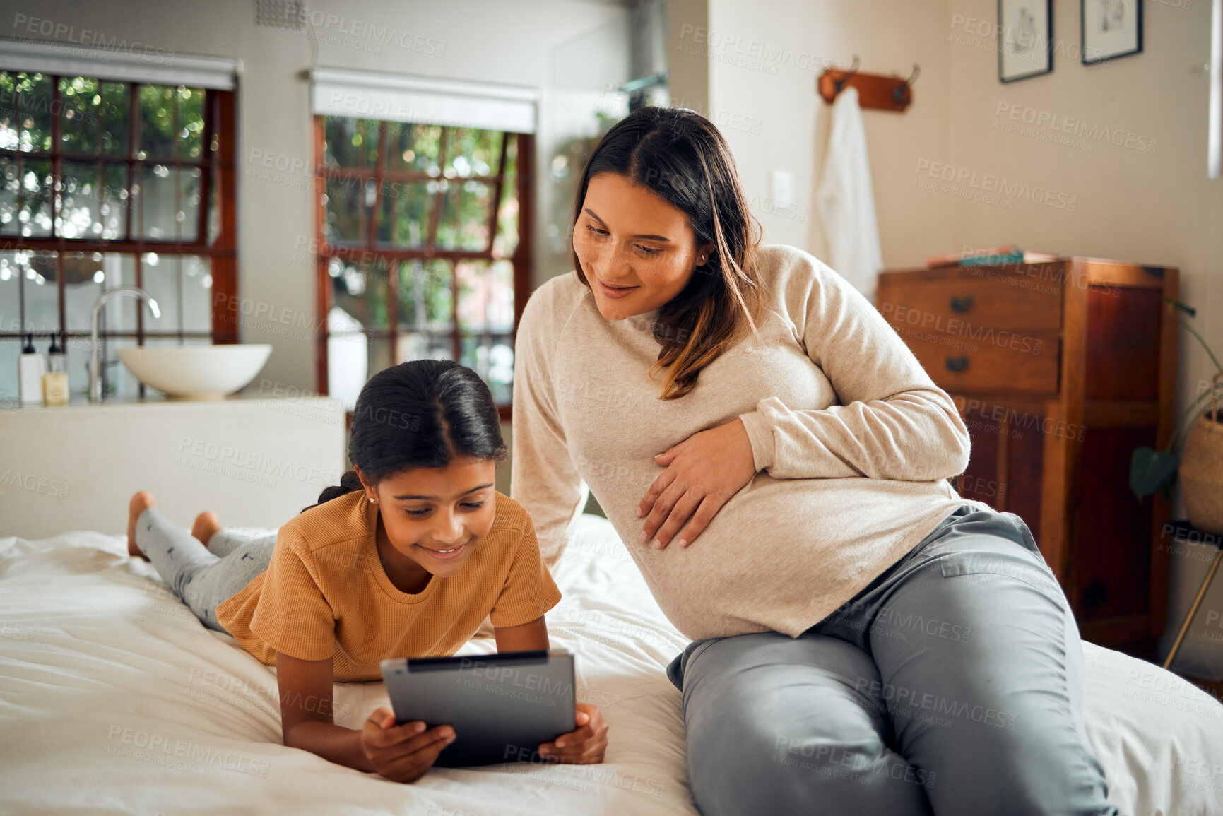 Buy stock photo Pregnant woman, child and tablet for online learning in home bedroom for bonding, education and knowledge. Smile of kid and mother together bedroom for pregnancy research and support on mobile app