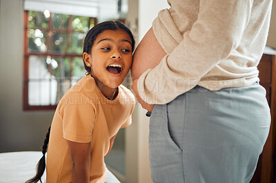 Buy stock photo Pregnant, family and excited with a girl listening to the belly of her mother while bonding in the bedroom of their home. Kids, mom and pregnancy with a daughter hearing the stomach of her mama