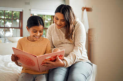 Buy stock photo Pregnant mother reading to kid for fun learning, language and home development help, support and bonding. Family, Indian people or mom and child, storytelling book for creative education or teaching