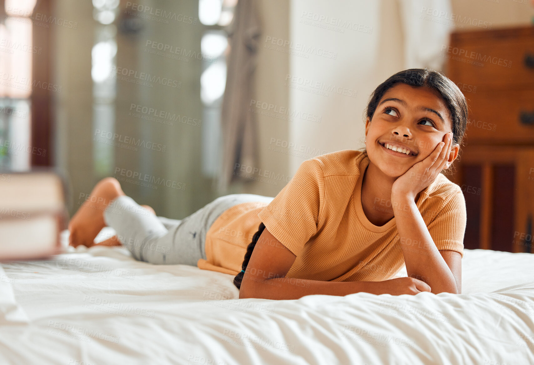 Buy stock photo Fantasy, bed and black girl thinking, ideas and relax on weekend, happiness and summer break. African American female child, young lady or daydreaming, imagination and thought with wonder and bedroom