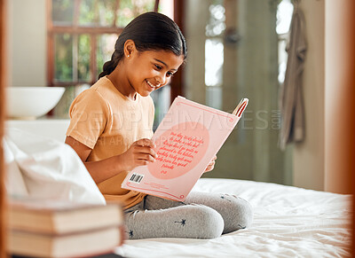 Buy stock photo Child or girl reading for home learning, story and language education with creative development o bed. Happy, kindergarten Indian kid with English books for smart, intelligent and fun house activity