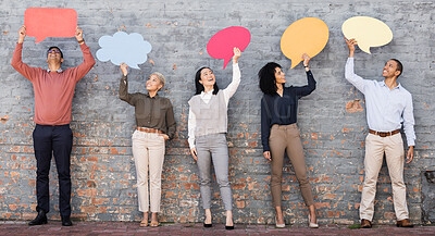 Buy stock photo Speech bubble, feedback and question with business people and mockup for social media, vote and review. Design, contact and chat sign with employee and board at brick wall for voice, opinion and idea