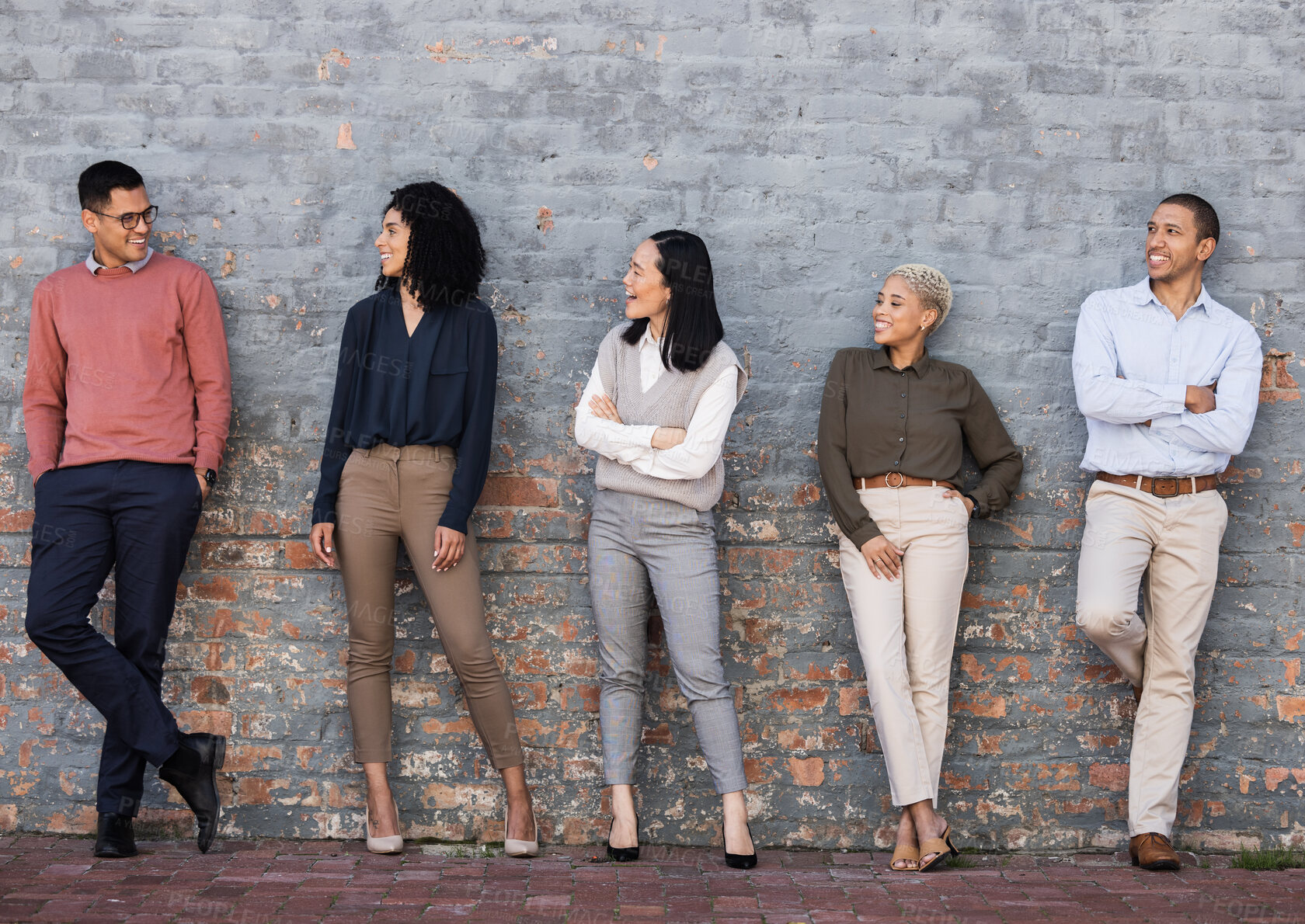 Buy stock photo Diversity, smile and team standing at wall at creative startup company waiting for recruitment. Human resources, job opportunity and group of happy hr employees in row, business people stand together