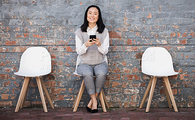 Buy stock photo Woman waiting for interview on chair with phone, recruitment and employment with smile. Portrait of happy person in Japan sitting on chair, smiling and excited for job opportunity for Japanese people