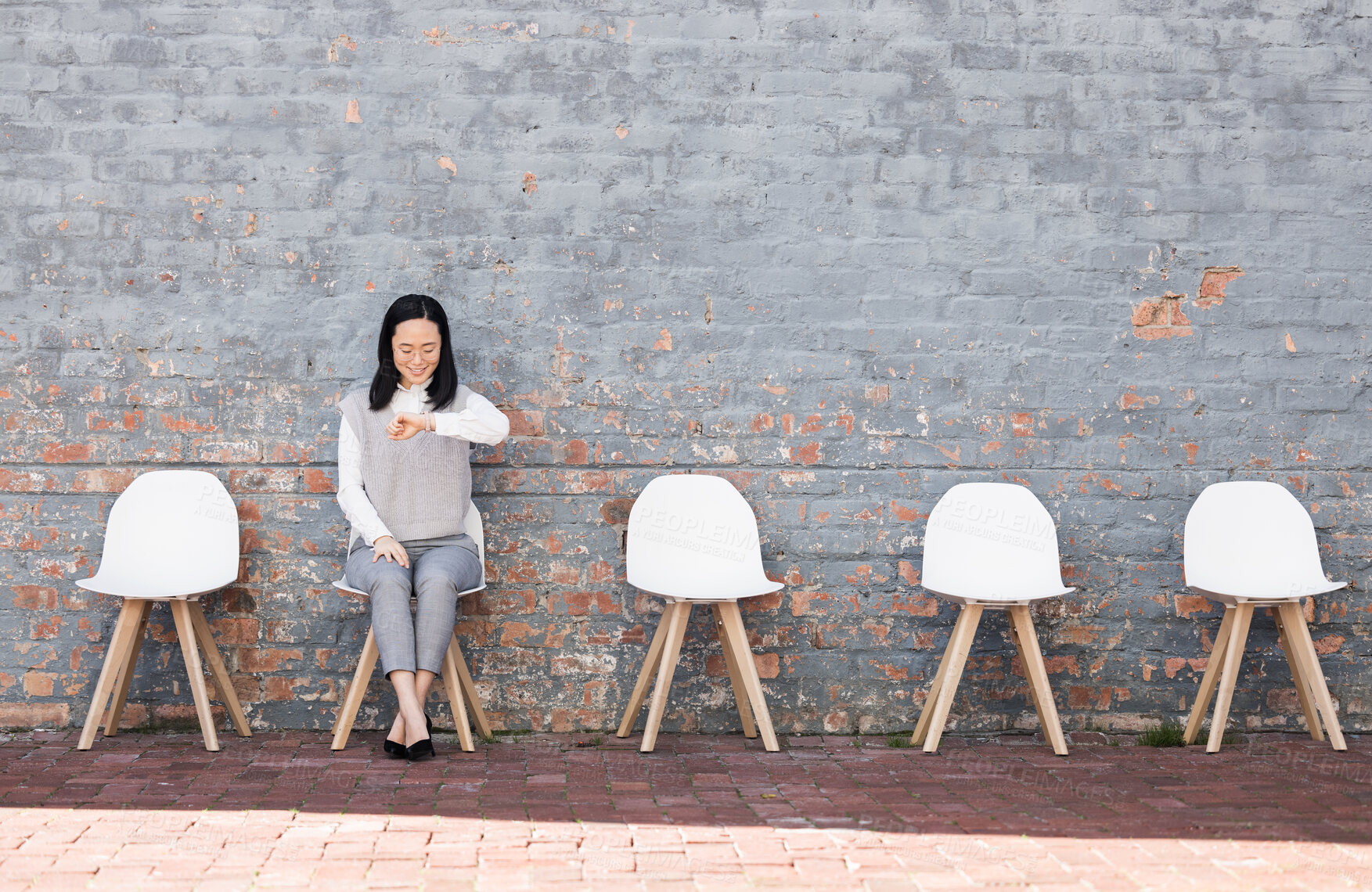 Buy stock photo Waiting, interview and woman check time for recruitment, job opportunity and human resources feedback. Asian person alone on chair looking at watch for career news, feedback and appointment schedule