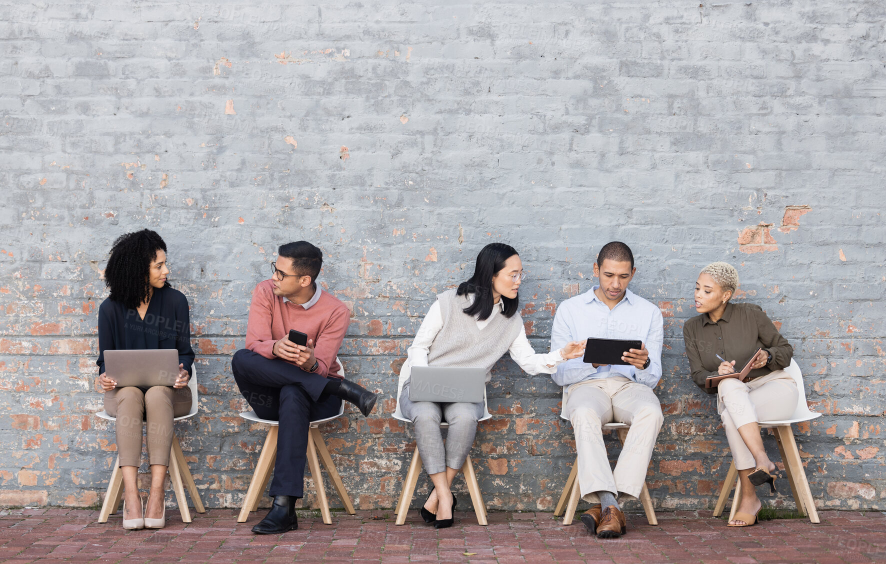 Buy stock photo Diversity, worker interview line and discussion with technology for meeting, recruitment or company hiring. Human resources, happy employees and speaking together on laptop, tablet or smartphone