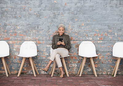 Buy stock photo Recruitment, job search and woman on brick wall sitting in line with phone for opportunity, hr email and success. Smartphone, waiting room and black people on social media for career networking app