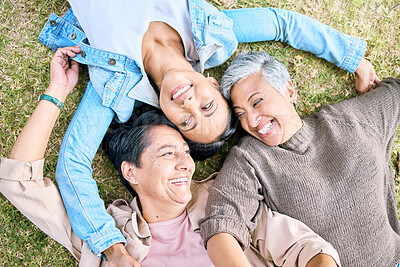 Buy stock photo Park, friends relax and top view of women bonding, caring and enjoying quality time together. Peace, freedom and happy group of retired senior females lying on grass talking, chatting and having fun.